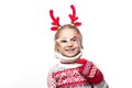 Cute young girl wearing deer horns. New year concept. Royalty Free Stock Photo