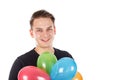 Cute young guy with colorful balloons Royalty Free Stock Photo