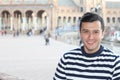 Cute young guy with a nautical style striped sweater