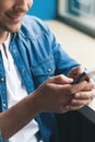 Cute young guy is using modern telephone Royalty Free Stock Photo