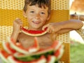 Cute young little boy with watermelon crustes Royalty Free Stock Photo