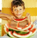 Cute young little boy with watermelon crustes smiling Royalty Free Stock Photo