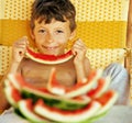 Cute young little boy with watermelon crustes smiling Royalty Free Stock Photo