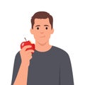 Cute young man eating apple