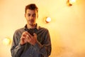 Cute young man with his cellphone Royalty Free Stock Photo