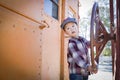 Cute Young Mixed Race Boy Having Fun on Railroad Car Royalty Free Stock Photo