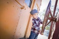 Cute Young Mixed Race Boy Having Fun on Railroad Car Royalty Free Stock Photo