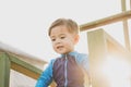 cute young mixed race boy smiling in the sun Royalty Free Stock Photo