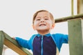 cute young mixed race boy smiling in the sun Royalty Free Stock Photo