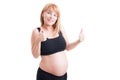 Cute young pregnant girl pointing finger to the camera Royalty Free Stock Photo