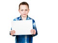 Cute young smiling schooler boy hold blank sign with copy space isolated on white background Royalty Free Stock Photo