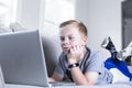 Young student doing online school work from home