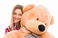 Cute young tenage girl hugs her teddy bear