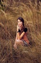 Cute young woman in the autumn field Royalty Free Stock Photo