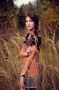 Cute young woman in the autumn field Royalty Free Stock Photo