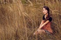 Cute young woman in the autumn field Royalty Free Stock Photo