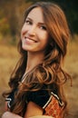 Cute young woman in the autumn field Royalty Free Stock Photo