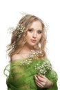 Cute young woman with flowers and healthy curly hairdo isolated on white Royalty Free Stock Photo