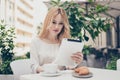 Cute young woman having break from work, want to have a snack, Royalty Free Stock Photo