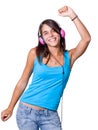 Cute young woman with headphones dancing on music