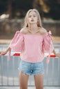 Cute young woman outdoors on a sunny day in summer