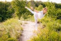 Cute young woman practicing yoga, standing in Warrior three exercise, Virabhadrasana III pose Royalty Free Stock Photo