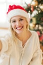 Cute, young woman with Santa's hat