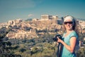 Cute young woman takes a picture of the Acropolis, Athens Royalty Free Stock Photo