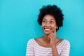 Cute young woman thinking and looking up Royalty Free Stock Photo