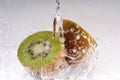 Cuted kiwi with splashing water Royalty Free Stock Photo