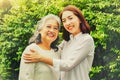 The cuteness of two mothers and daughters having fun together in the garden. Royalty Free Stock Photo