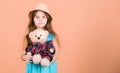 Cutest ever. Small girl straw hat hold teddy bear plush toy. In love with cute teddy bear. Happy childhood. Tender