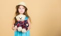 Cutest ever. Small girl straw hat hold teddy bear plush toy. In love with cute teddy bear. Happy childhood. Tender