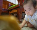Cutie asian male baby very serious and look at tablet Royalty Free Stock Photo