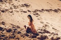 Cutie girl in pink dress in desert