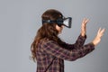 Cutie woman testing virtual reality helmet Royalty Free Stock Photo