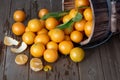 Cuties tangerines  from wooden bucket Royalty Free Stock Photo