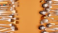 Cutlery. Flat lay photo of variety of antique silverware and gold kitchen forks and spoons arranged against studio