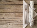 Cutlery kitchenware and cracker on old wooden boards background