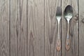 Cutlery kitchenware on old wooden boards background Royalty Free Stock Photo