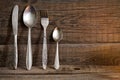 Cutlery kitchenware on old wooden boards background Royalty Free Stock Photo