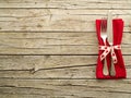 Cutlery kitchenware on old wooden boards background