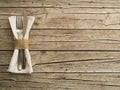 Cutlery kitchenware on old wooden boards background