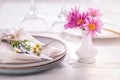 Cutlery with napkin and flower decoration - fine dining and place setting