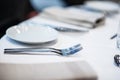 Cutlery and plate on a table in a restaurant