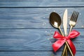 Cutlery set on blue wooden table, top view. Christmas celebration Royalty Free Stock Photo