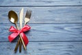 Cutlery set on blue wooden table, top view. Christmas celebration Royalty Free Stock Photo