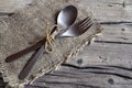 Cutlery set:fork and spoon on rustic wooden table.Cutlery on old wooden background.Can be used as background menu for restaurant. Royalty Free Stock Photo