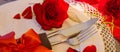 Cutlery set with red roses and ribbon decorative hearts, Valentines day concept Royalty Free Stock Photo