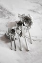 Cutlery set - tea spoon, table spoon, dessert fork, table fork and table knife Royalty Free Stock Photo